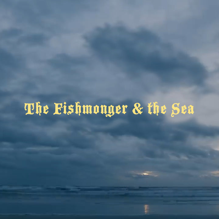 Dark skies over the ocean with yellow text spelling out The Fishmonger &The Sea