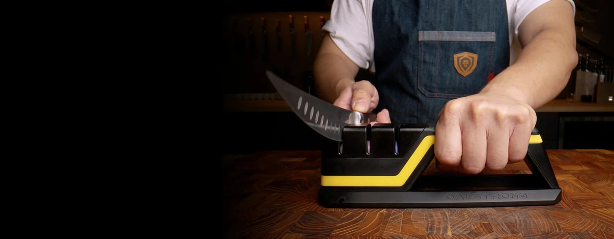 A cook using Hornet to sharpen a kitchen knife