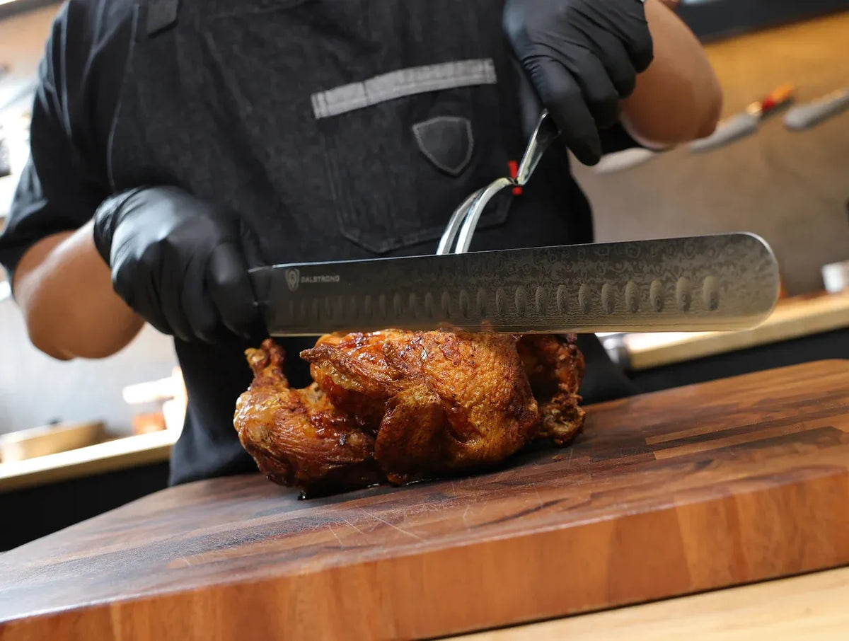 Dalstrong slicing knife carving a roast on a wooden board