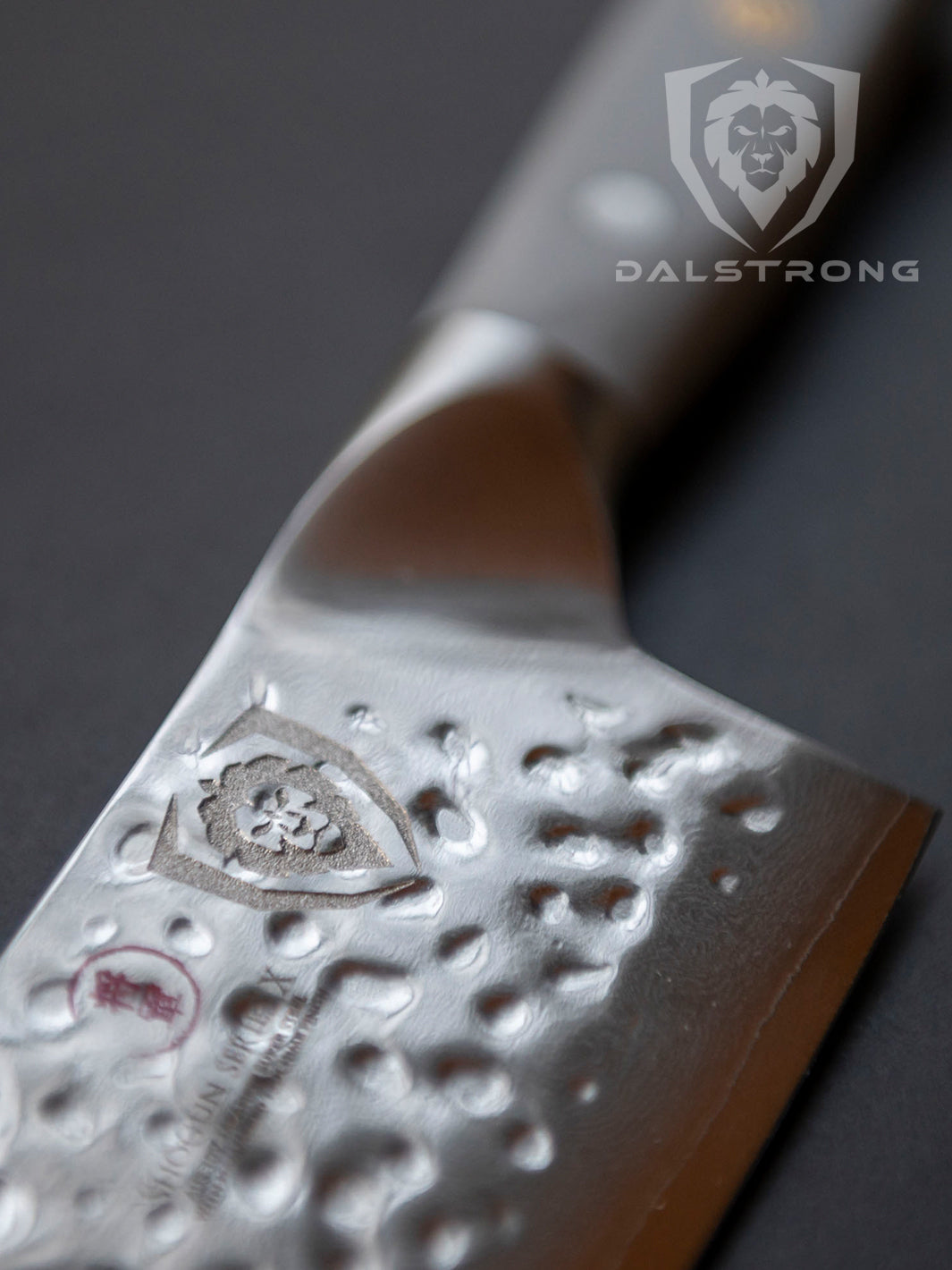 Dalstrong shogun series 8 inch chef knife with gray matte handle and logo of Dalstrong.