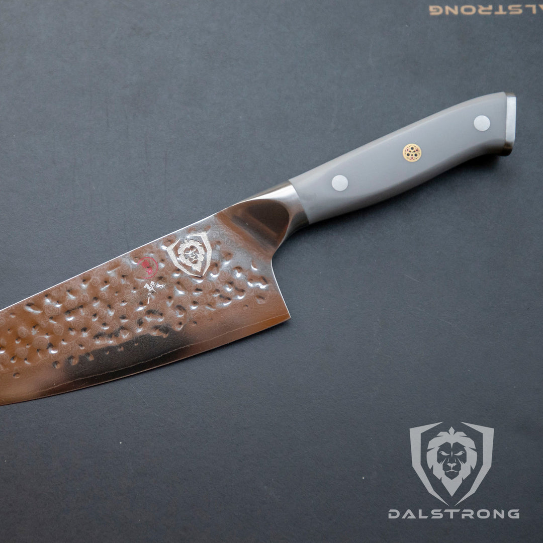 Dalstrong shogun series 8 inch chef knife with gray matte handle on a solid surface.