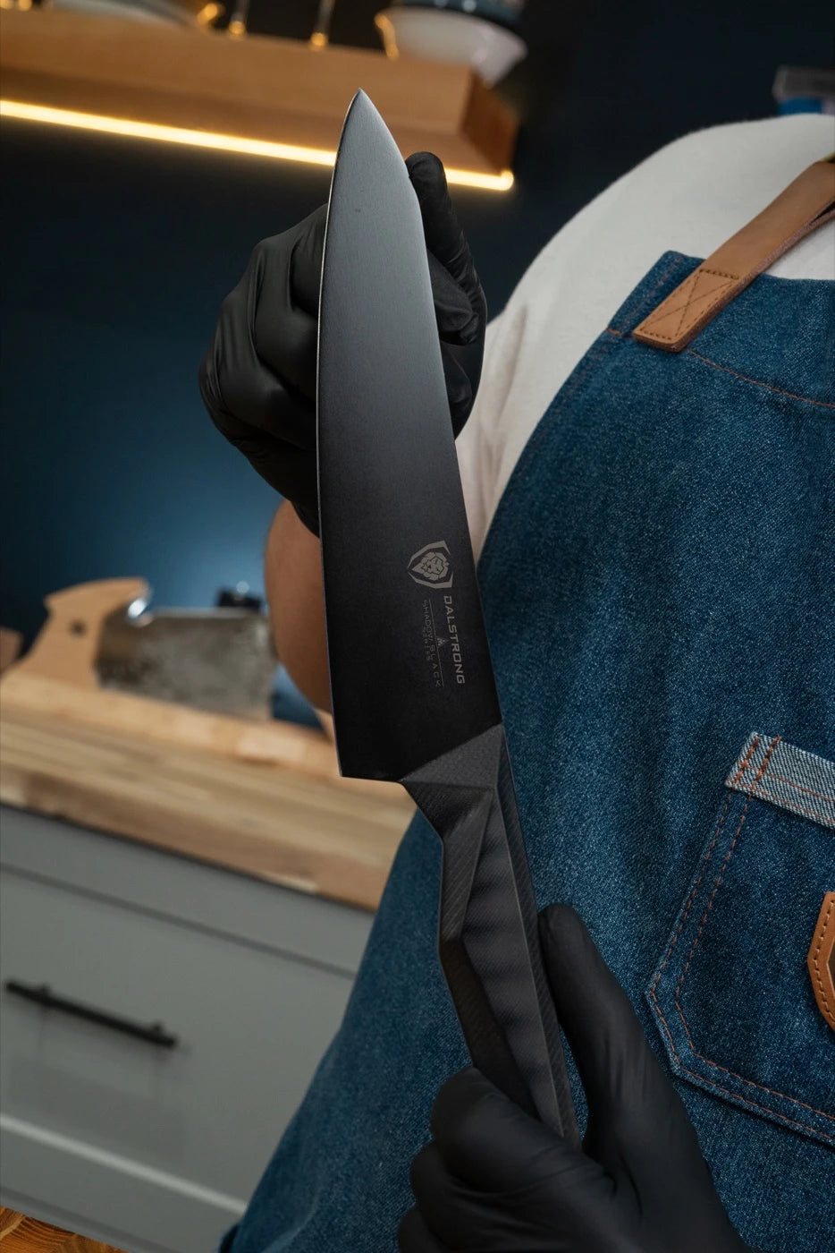 A Dalstrong knife in hand, ready for the next cook