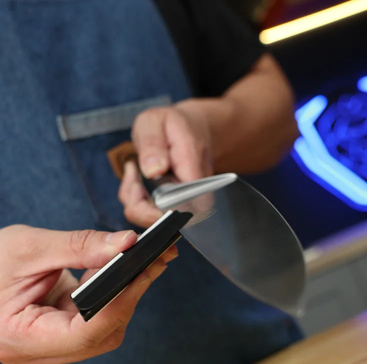 Fitting the 15-degree sharpening guide onto a knife blade