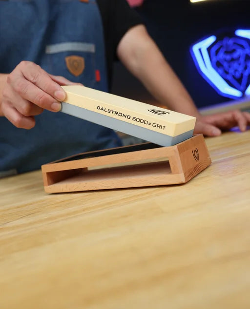 Lifting the non-soak whetstone from its beech wood sharpening base