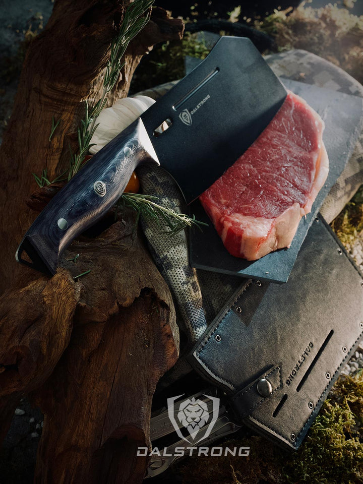 Dalstrong delta wolf series 7 inch cleaver knife with it's sheath and a steak.