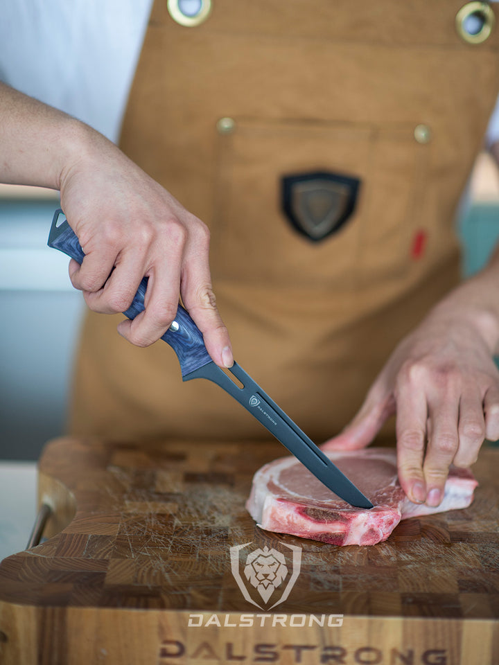 Dalstrong delta wolf series 6 inch boning knife deboning a porkchop.