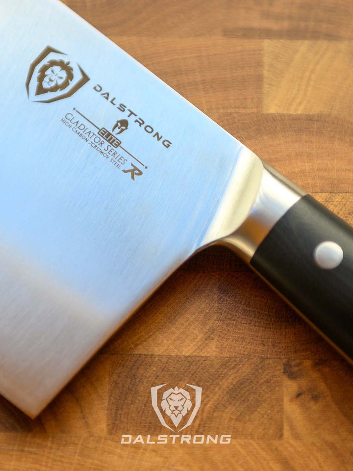 Dalstrong gladiator series 9 inch chinese cleaver with black handle and sheath on top of a cutting board featuring it's series and dalstrong logo.