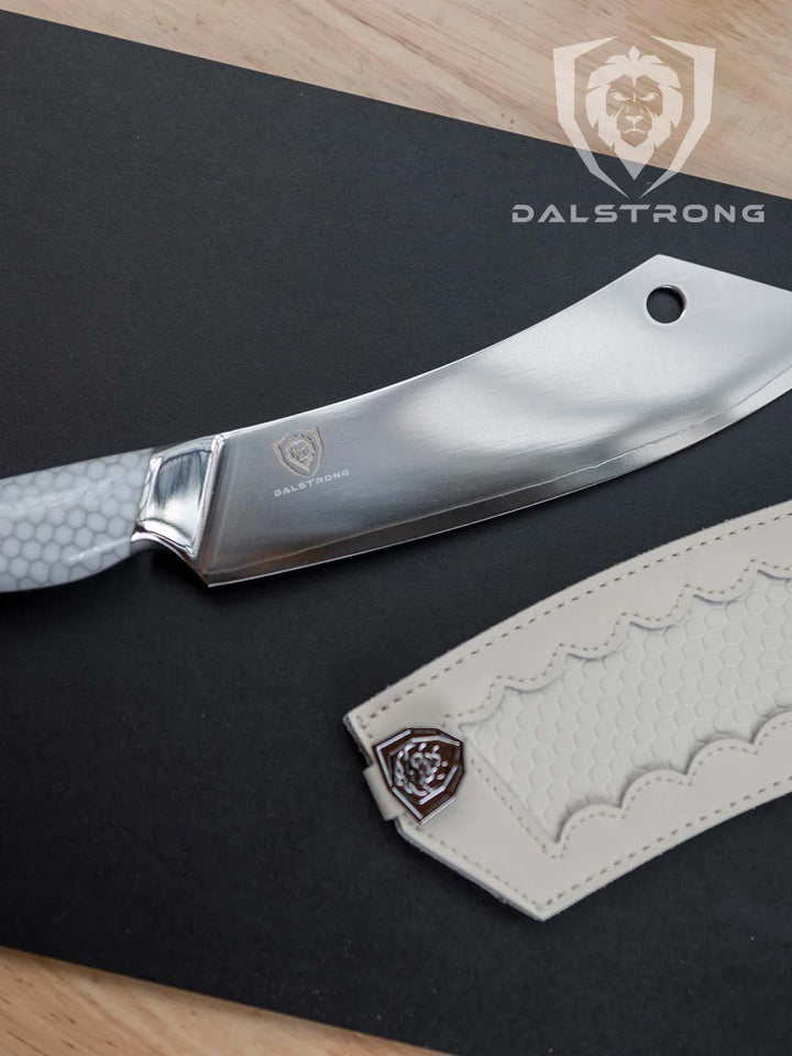 Dalstrong frost fire series 8 inch crixus cleaver knife with white honeycomb handle beside it's white sheath.