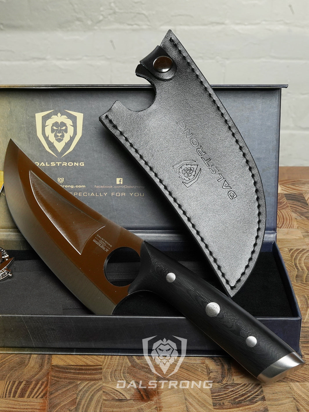 Dalstrong gladiator series 7 inch venator knife with black handle and sheath ouside it's premium packaging.