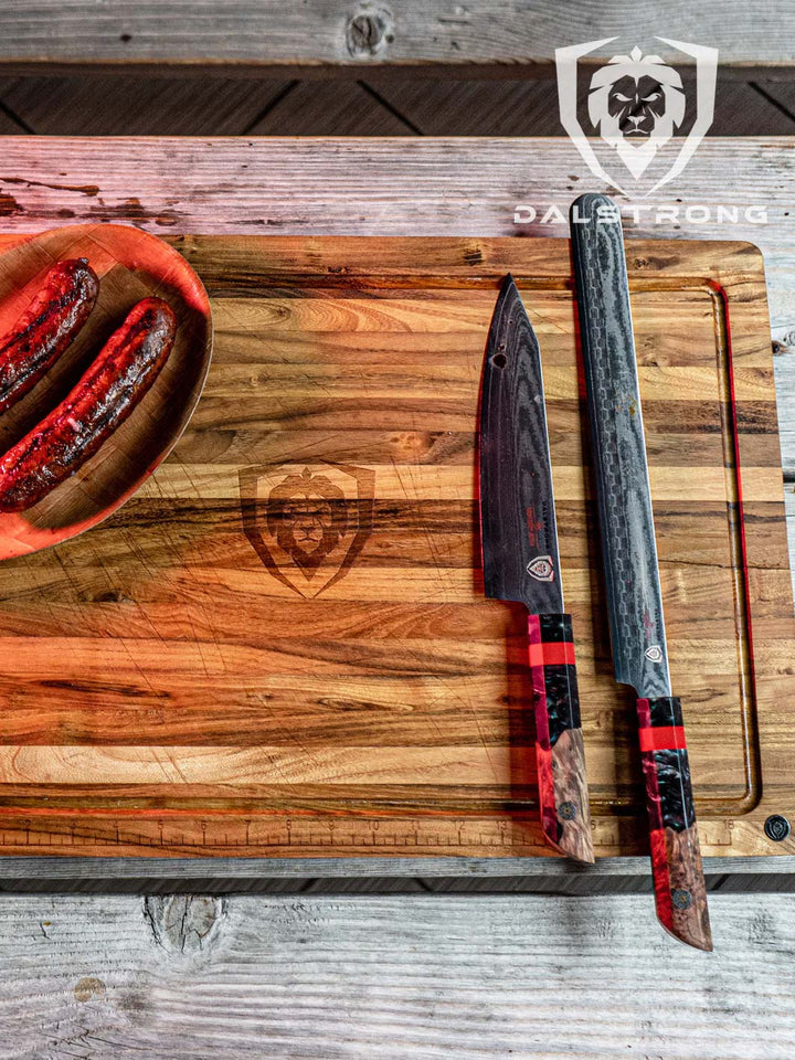Dalstrong firestorm alpha series 12 inch slicer knife with wooden handle and two sausages on a cutting board.