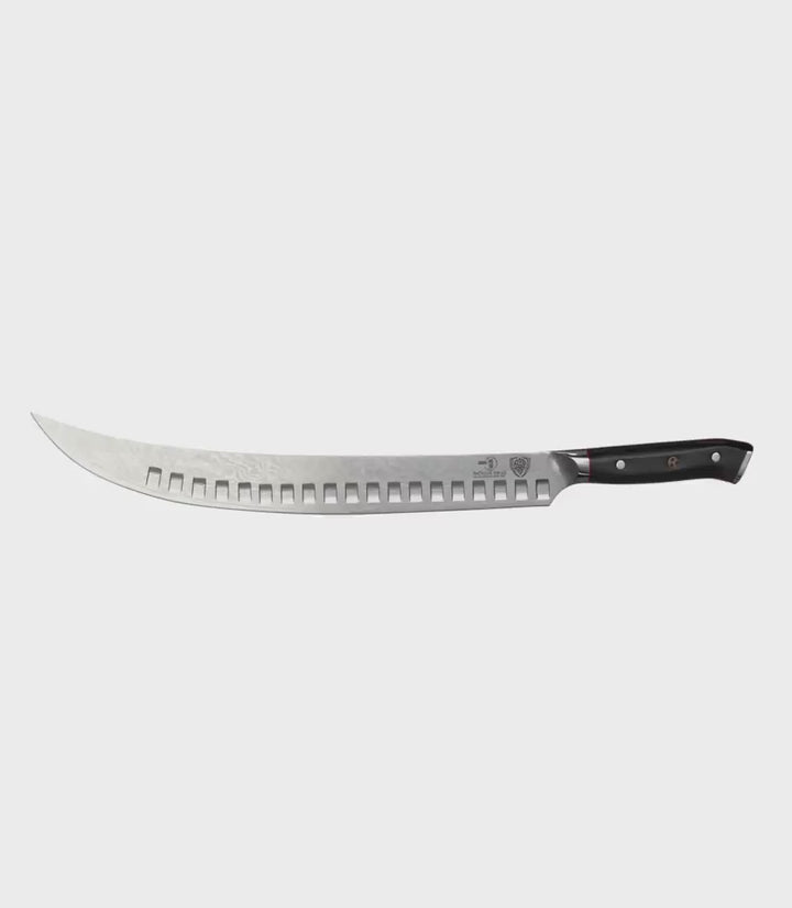 Dalstrong shogun series 12.5 inch butcher knife with black handle in all angles.