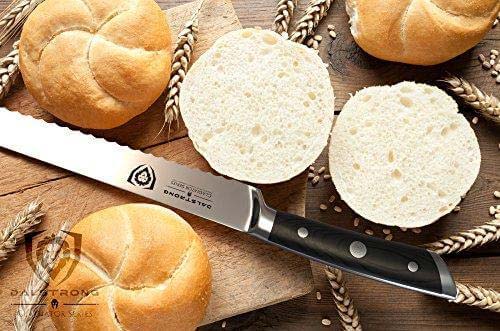 Dalstrong gladiator series 10 inch serrated bread knife with black handle and breads on a wooden board.
