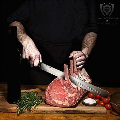 Dalstrong gladiator series 12 inch slicer knife slicing through a large cut of meat on a wooden table.