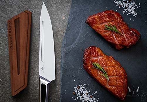 Dalstrong crusader series 8 inch chef knife with it's wooden sheath beside two roasted duck meat.