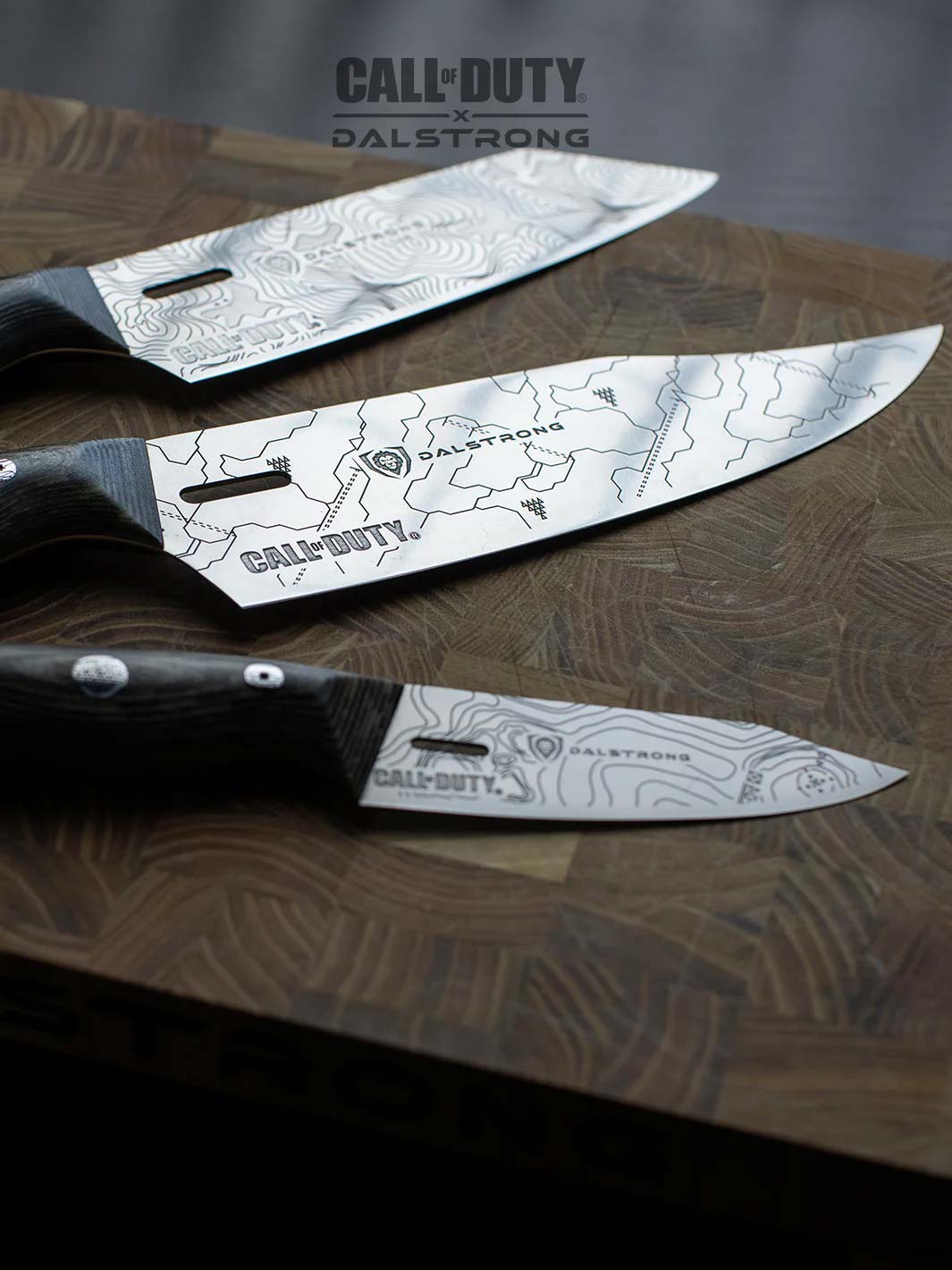 Dalstrong call of duty series 3 piece knife set on a cutting board.