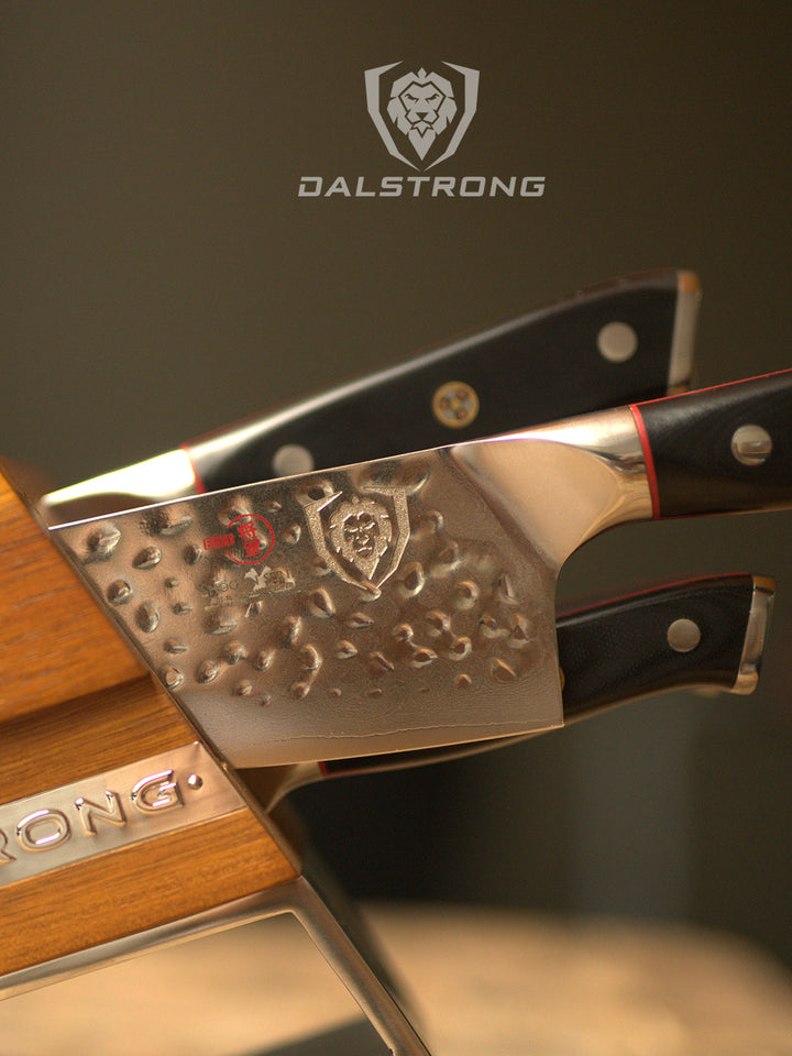 Dalstrong shogun series 5 piece knife block set with black handles and Dalstrong logo.