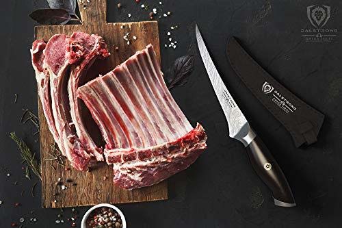 Dalstrong omega series curved boning knife with black sheath beside a rack of ribs on a cutting board.