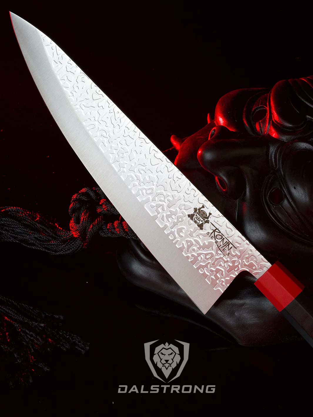 Dalstrong ronin series 9.5 inch chef knife with black handle and a oni mask.