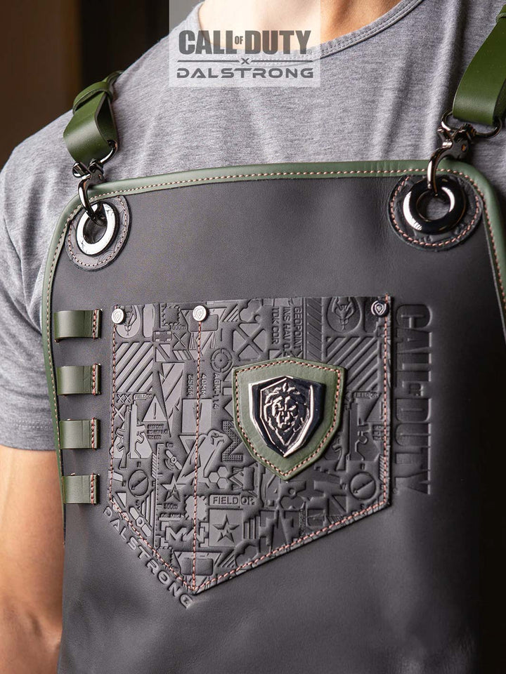 A man wearing the Dalstrong call of duty limited edition chef leather apron.