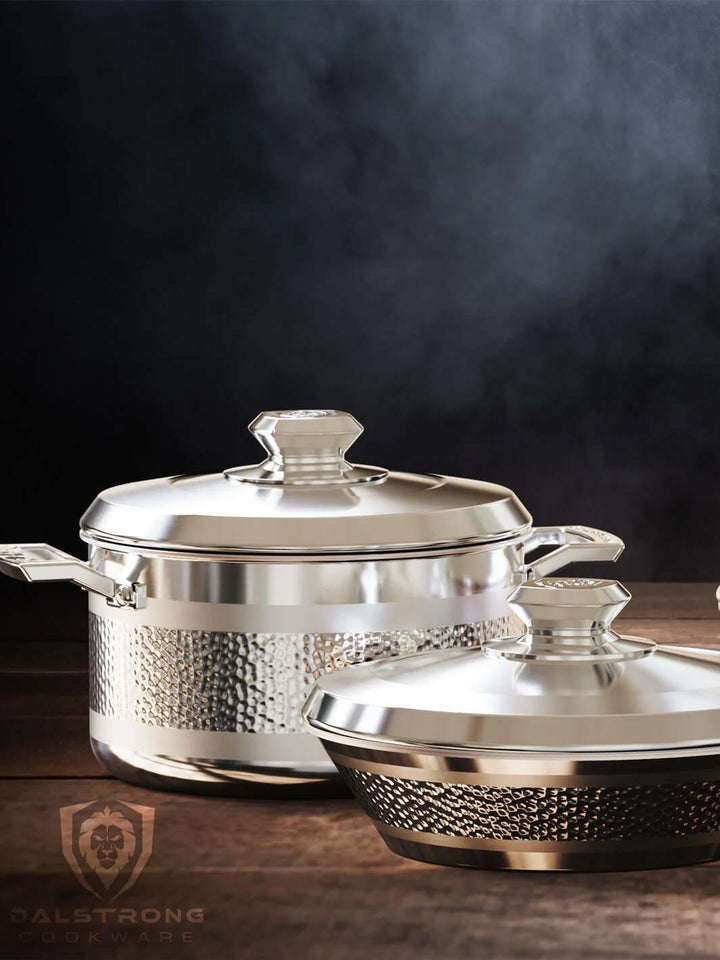 Dalstrong avalon series 6 piece cookware set silver on a wooden table.
