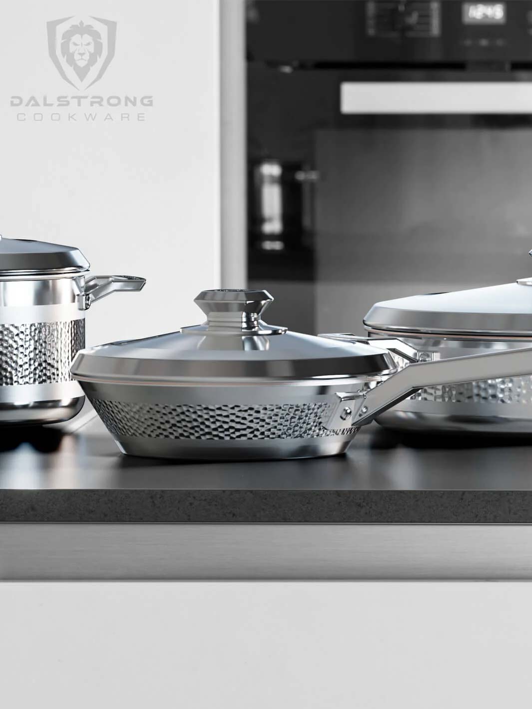 Dalstrong avalon series 6 piece cookware set silver on a marble table.