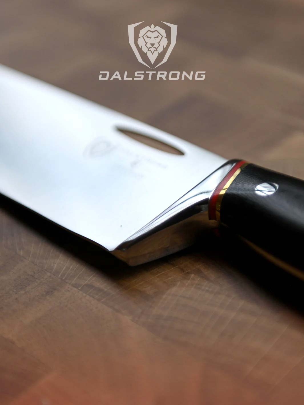 Dalstrong centurion series 10 inch chef knife with black handle on a cutting board.