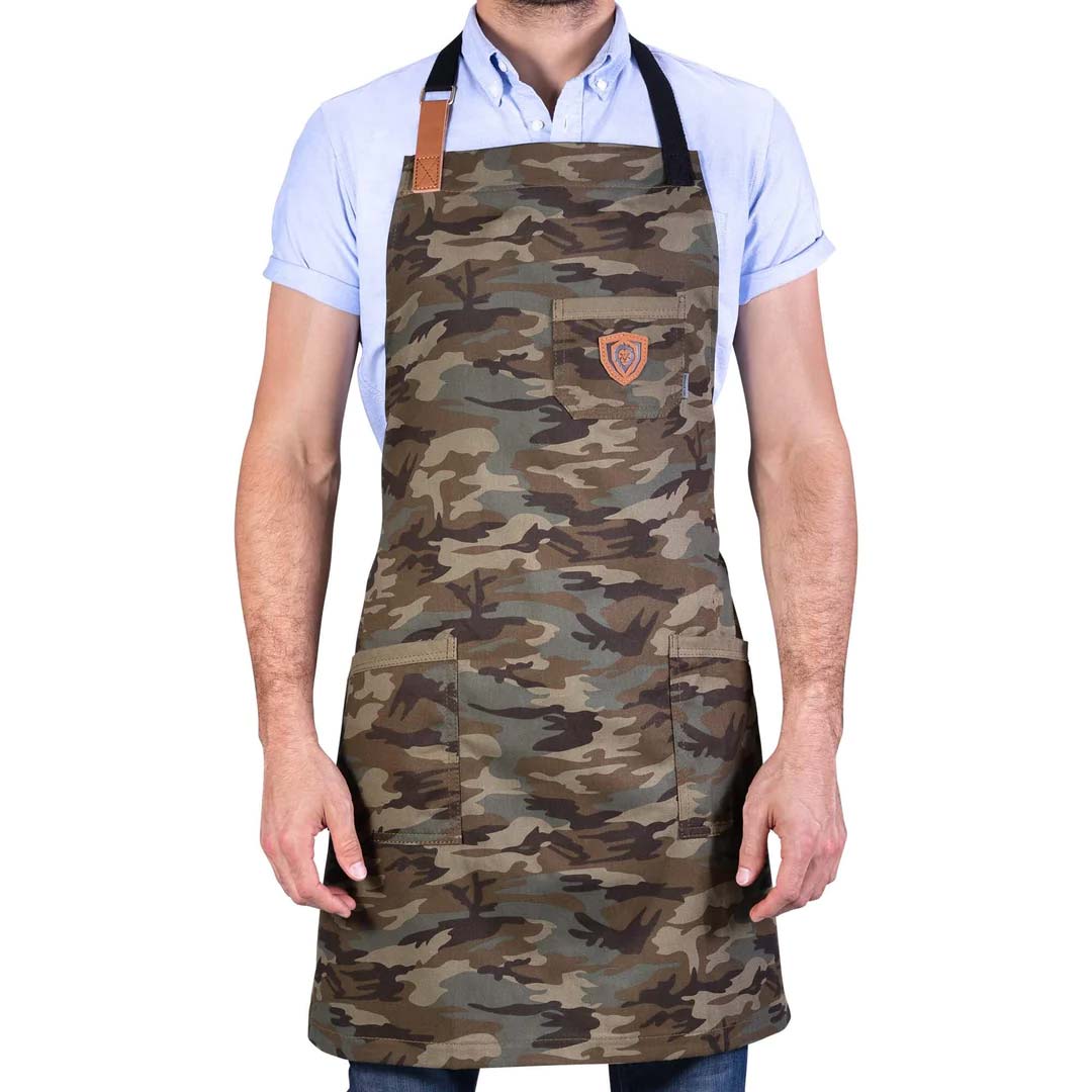 A man wearing the Dalstrong the kitchen rambo professional chef's kitchen apron.