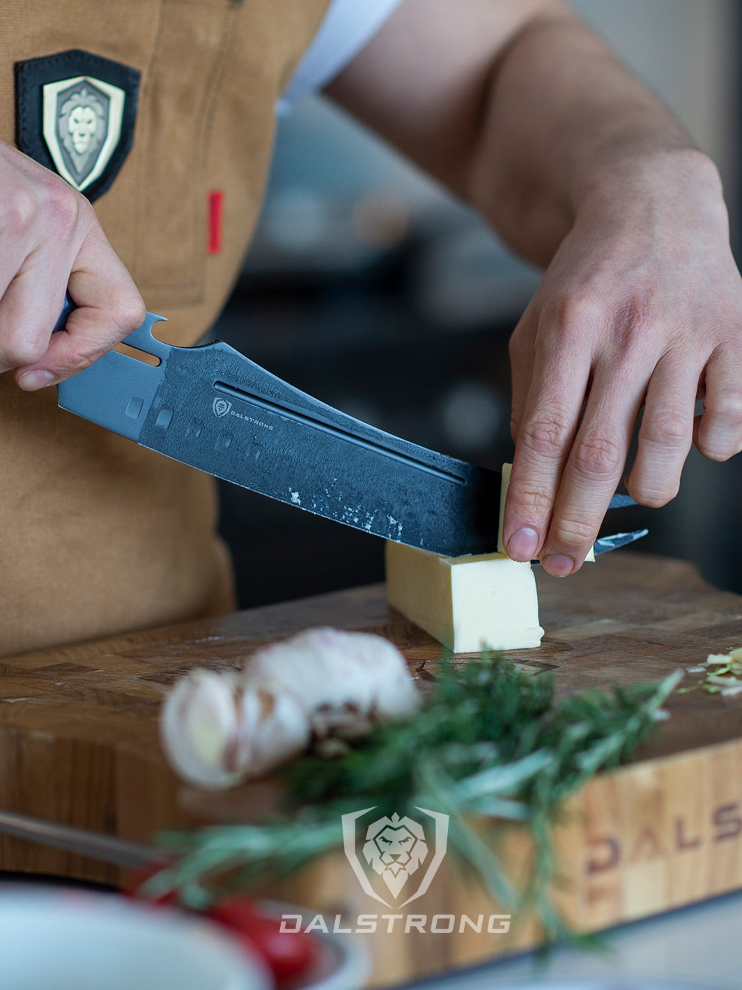 Dalstrong delta wolf series 9 inch pitmaster knife with forked tip and bottle opener with a sliced butter on a cutting board.