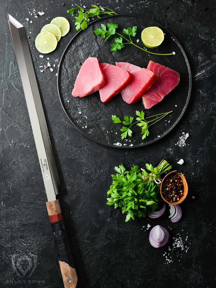 Dalstrong firestorm alpha series 17 inch helios slicer knife with four cuts of tuna meat.