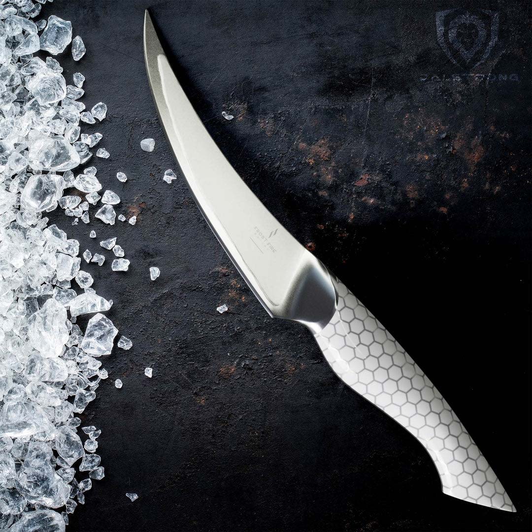 Dalstrong frost fire series 6 inch fillet knife with white handle beside some ice.