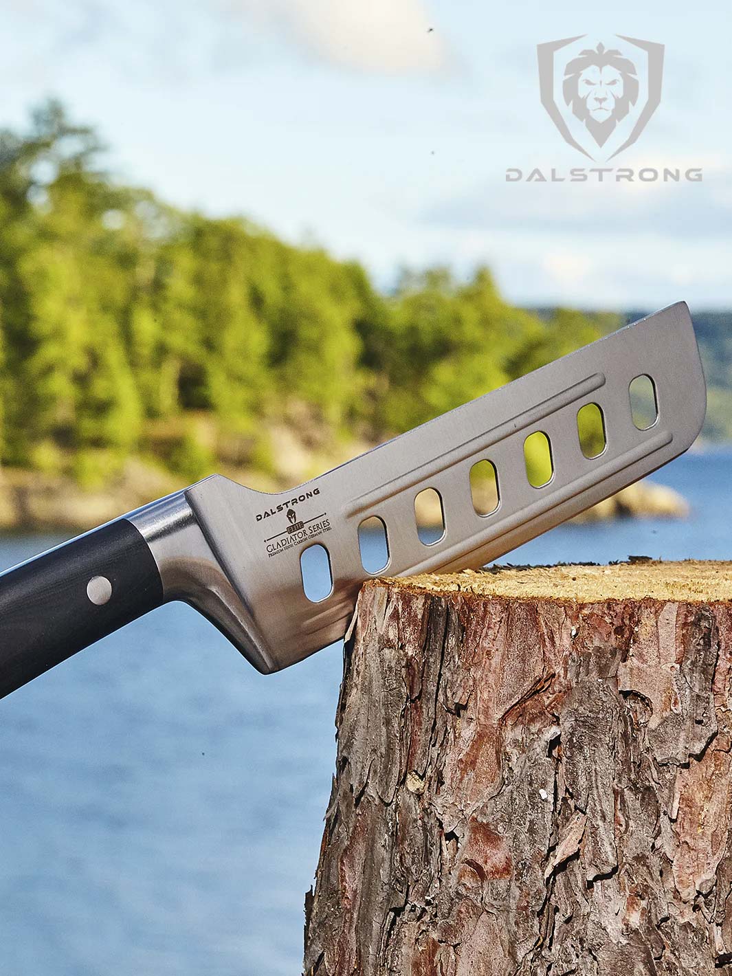 Dalstrong gladiator 6 inch offset nakiri knife with black handle on a log.