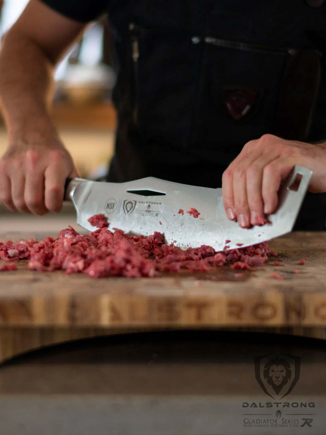 Dalstrong gladiator series 12 inch rocking cleaver knife chopping meat on a cutting board.