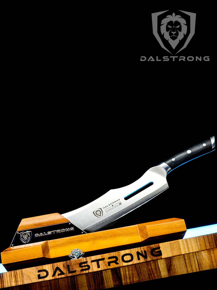 Dalstrong gladiator series 14 inch annihilator cleaver knife with black handle with wooden stand on top of a dalstrong wooden board.