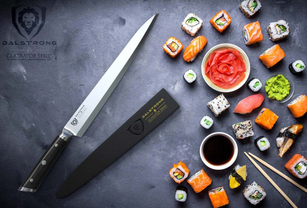 Dalstrong gladiator series 10.5 inch yanagiba knife with black handle and sheath beside different kinds of sushi.