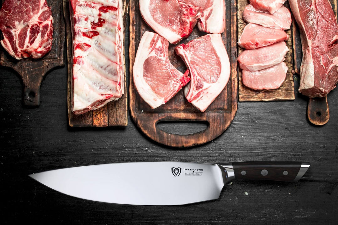 Dalstrong gladiator series 12.5 inch devastator cleaver knife with black handle and different cuts of meat above it.