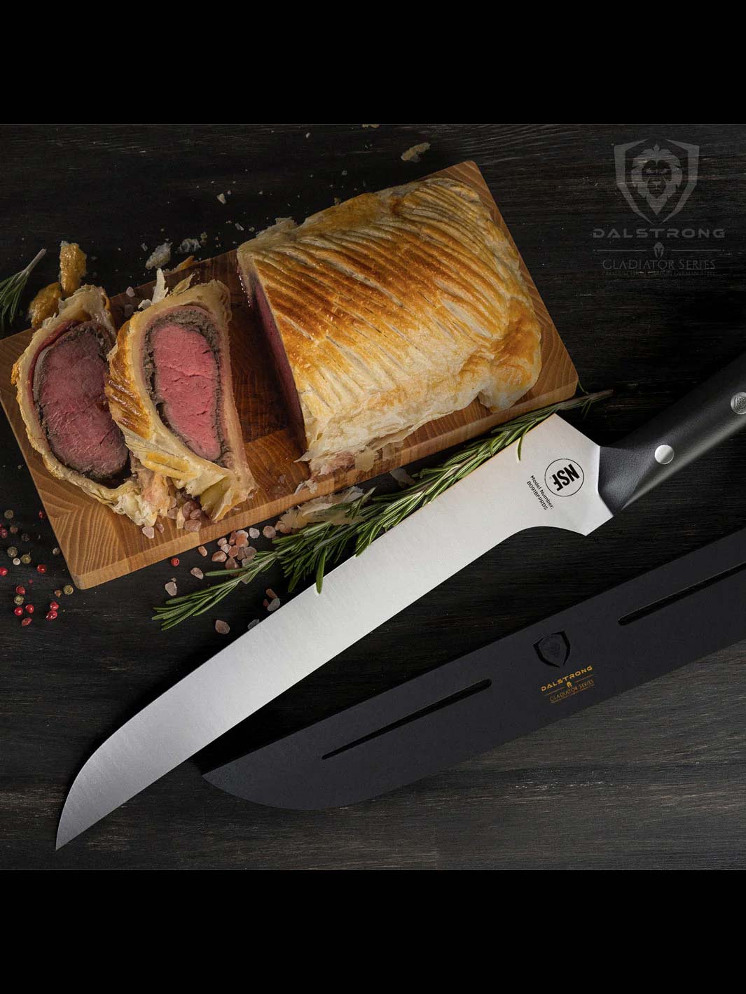 Dalstrong gladiator series 12 inch offset slicer knife with black handle and sheath beside sliced beef wellington.