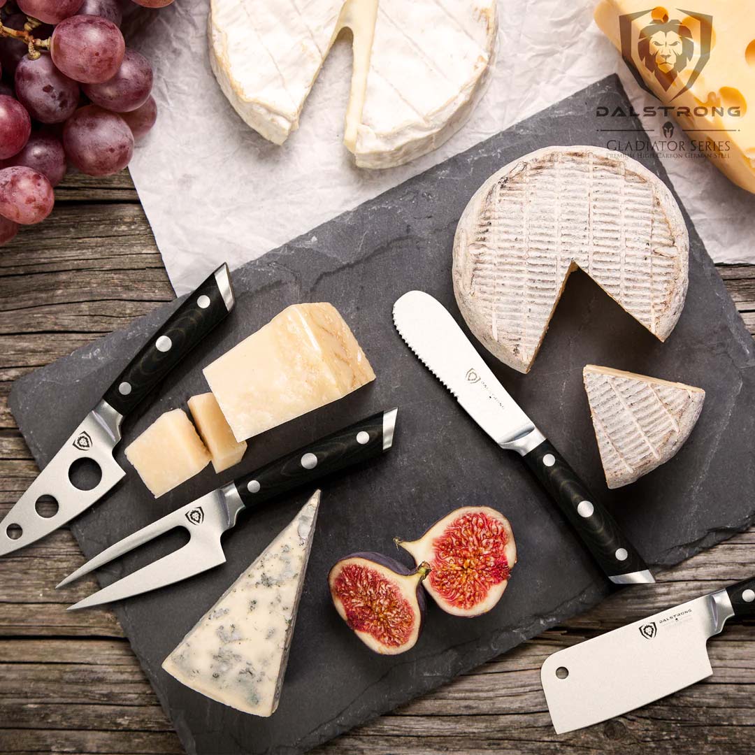 Dalstrong gladiator series 4 piece cheese knife set with black handles and slices of cheese on a board.