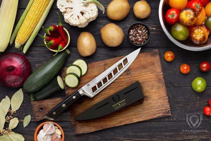 Dalstrong gladiator series 8 inch vegetable knife with black handle surrounded by vegetables.