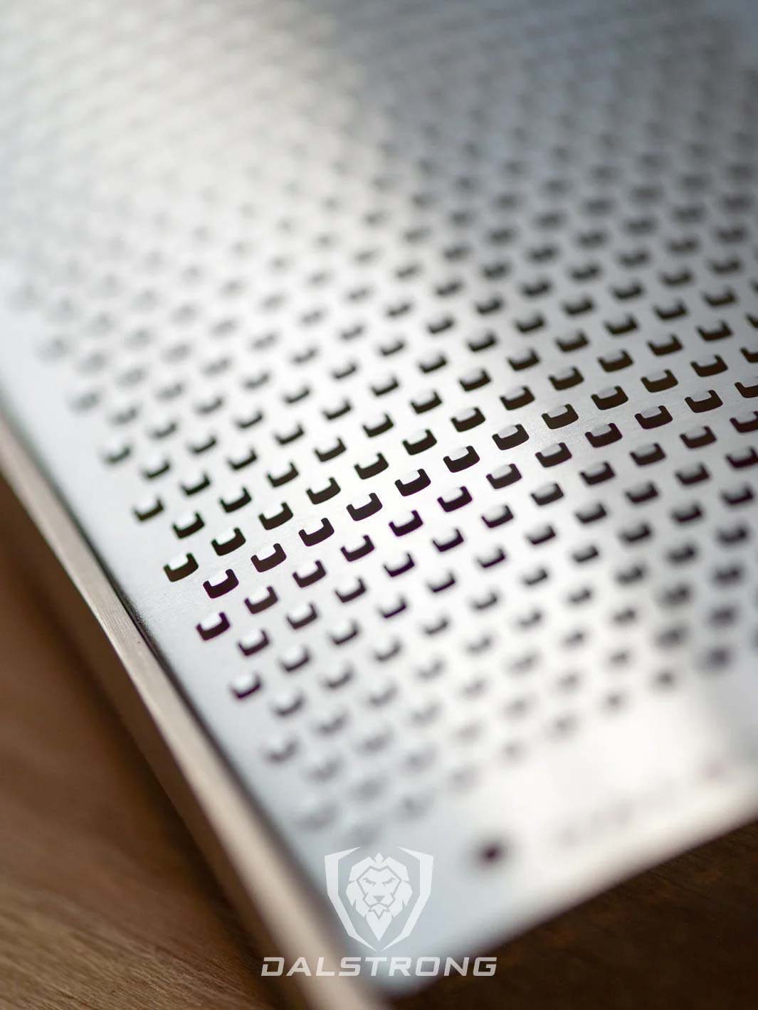 Dalstrong professional fine wide cheese grater showcasing it's stainless steel grater.