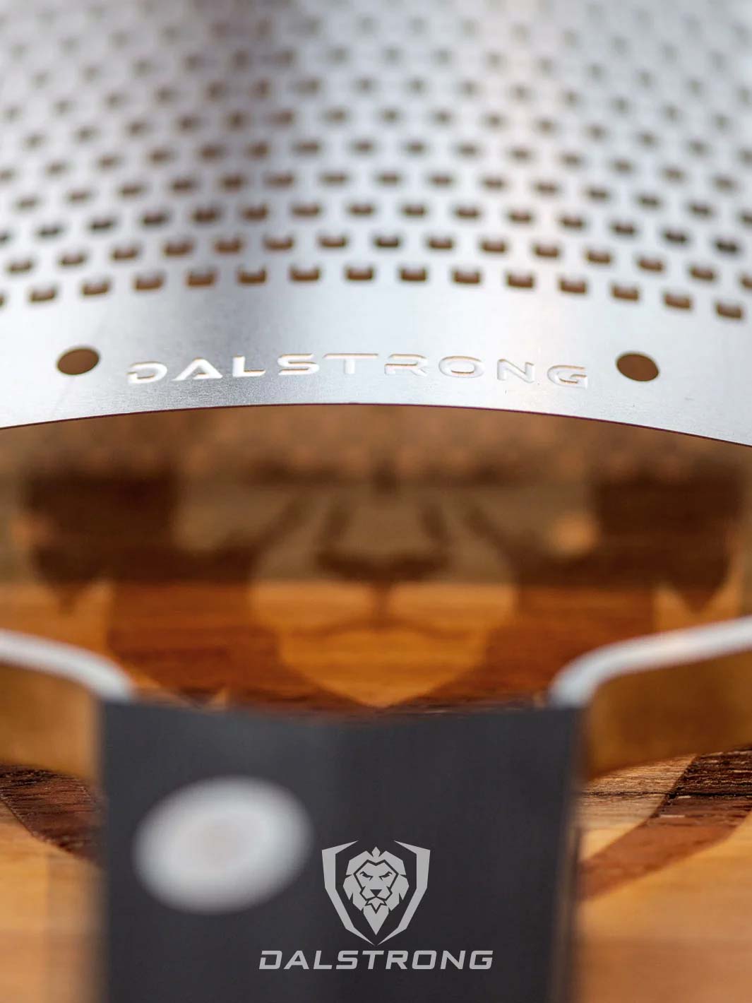 Dalstrong professional fine wide cheese grater showcasing it's stainless steel grater with dalstrong engraved on it.