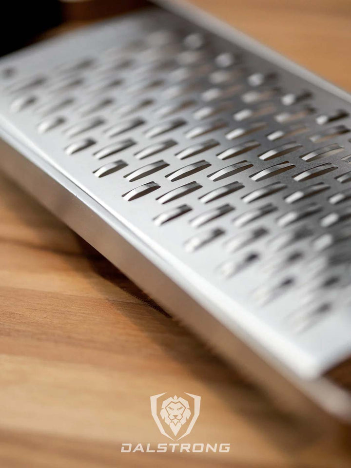 Dalstrong professional ribbon wide cheese grater with black handle featuring it's stainless steel grater.