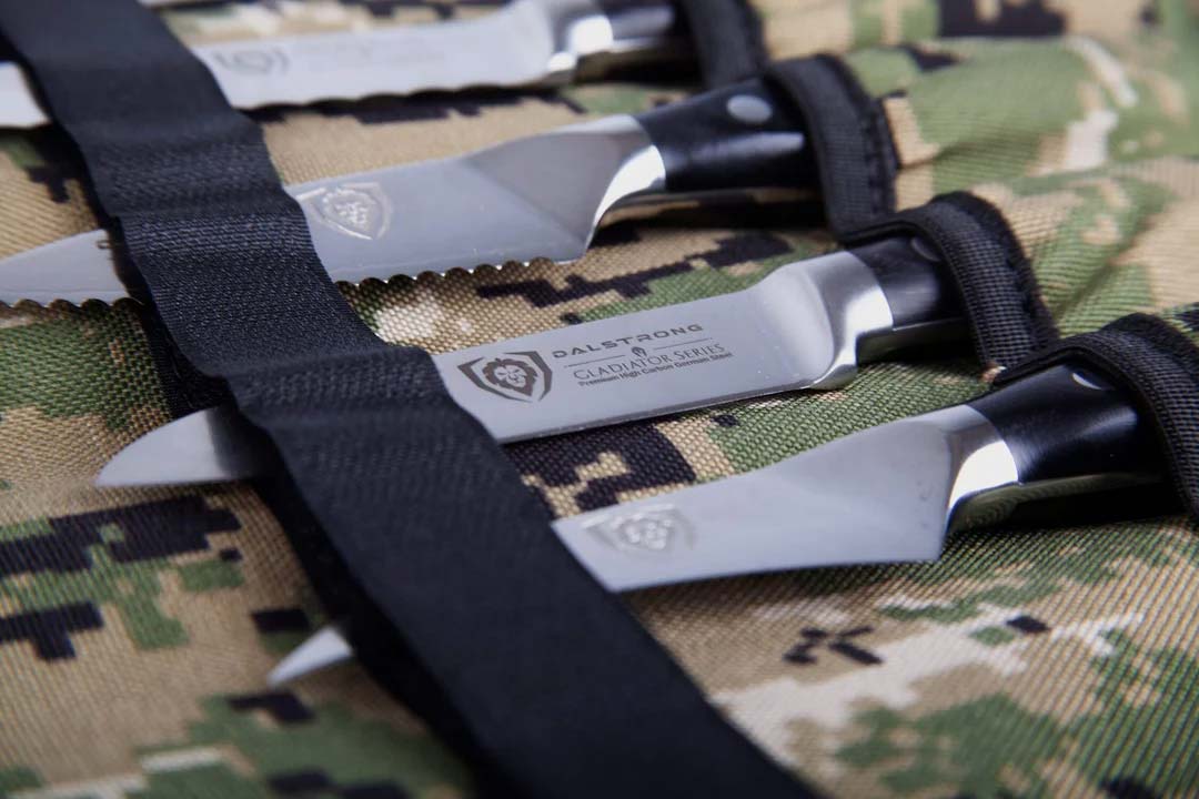 Dalstrong ballistic series camouflage premium knife roll with knives inside.
