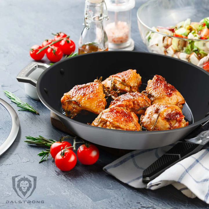 Dalstrong oberon series 12 inch frying pan and skillet eterna non-stick with coocked chicken inside.