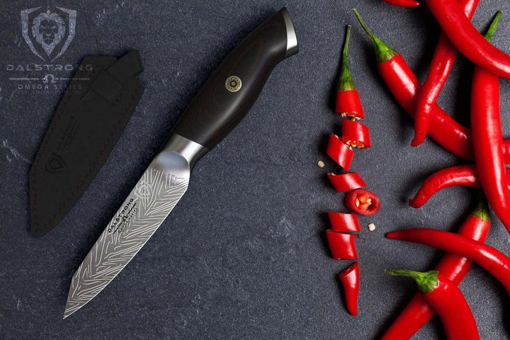 Dalstrong omega series 4 inch paring knife with red chilli at the side.