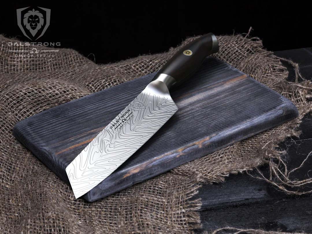 Dalstrong omega series 7 inch santoku knife on top of a wooden board.