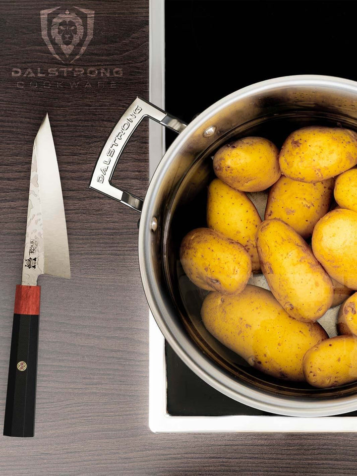 Dalstrong oberon series 8 quart stock pot silver with potatoes inside.