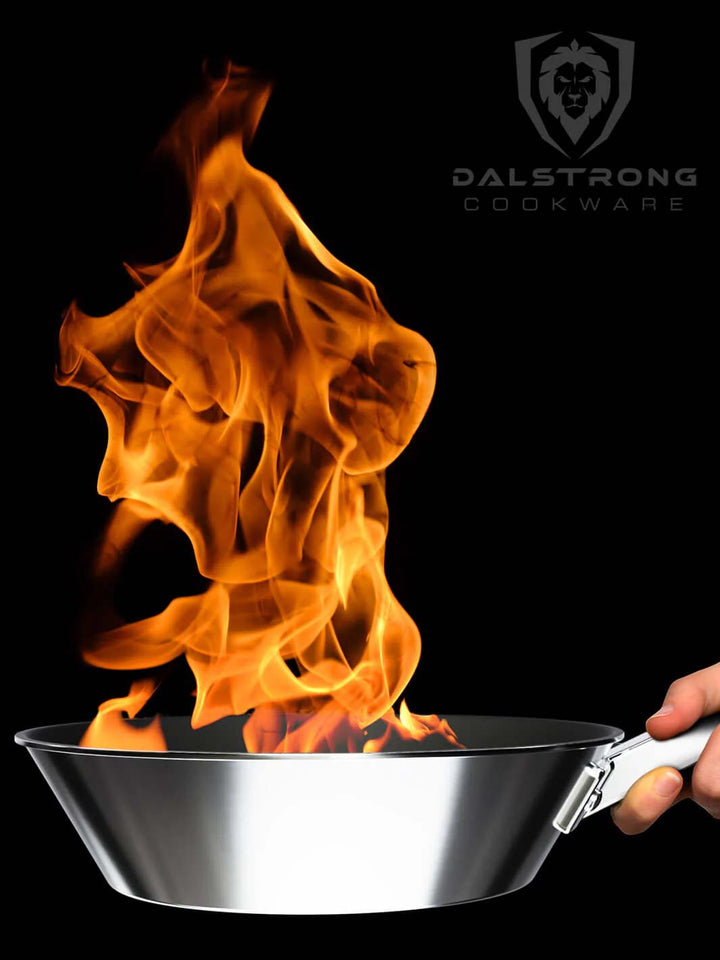Dalstrong oberon series eterna non-stick 9 inch frying pan and skillet with fire coming out of it.