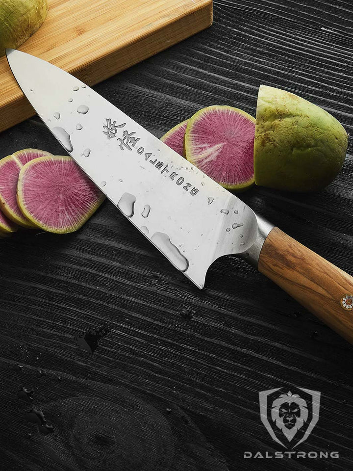 Dalstrong phantom series 8 inch chef knife with olive wood handle and slices of radish.