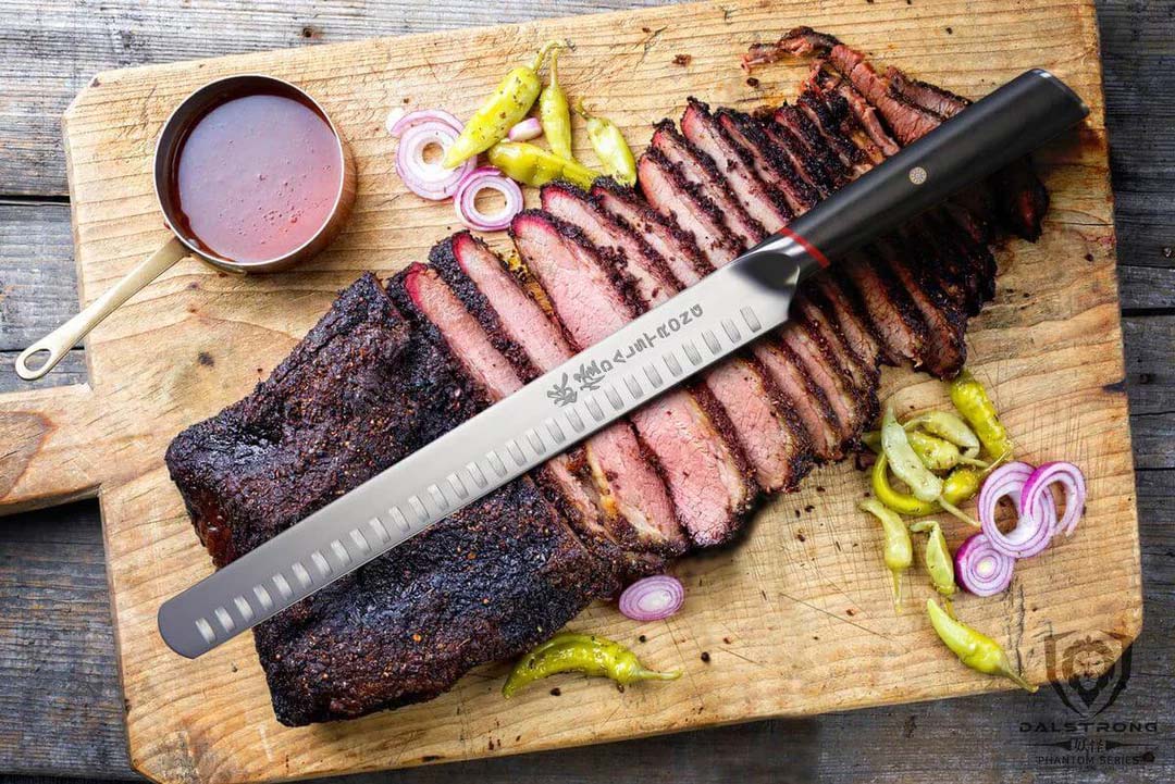 Dalstrong phantom series 12 inch slicer knife with pakka wood handle and slices of smoked brisket on a cutting board.