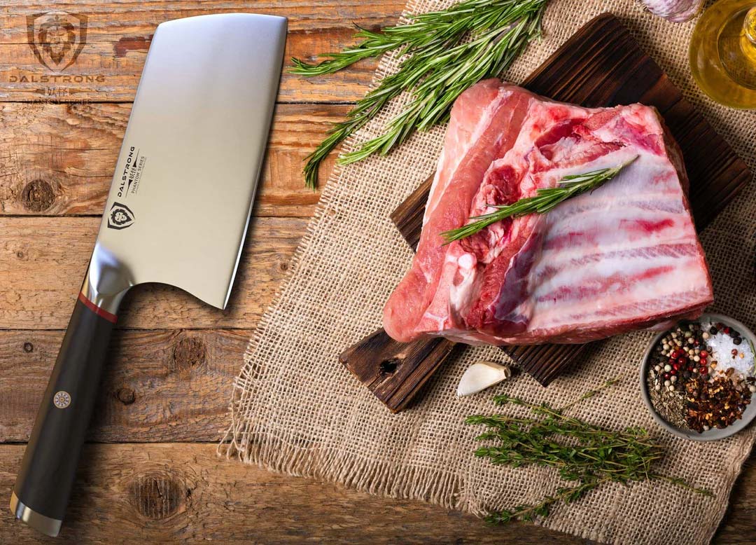 Dalstrong phantom series 7 inch cleaver knife with pakka wood handle and huge cut of meat on a cutting board.